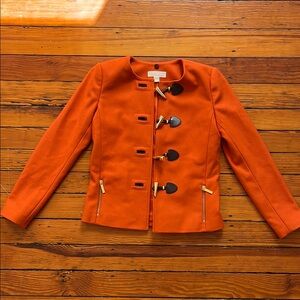Size 2 Michael Michael Kors jacket in burnt orange. Never worn.